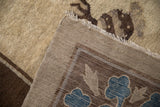 Reverse view of an antique Peking carpet showing its hand-knotted foundation and secured side cord.