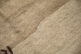 Varied texture of an antique Peking carpet showing both hand-knotted pile and foundation.