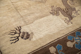 The textured pile of an antique Peking carpet featuring a brown five-toed dragon motif.