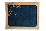 Antique Peking carpet with a large cobalt blue field and a single, delicate corner branch on an ivory border.