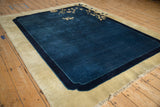 An angled perspective on the rich cobalt blue pile of an antique Chinese Peking rug.