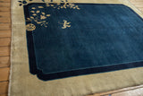 Intact side cord selvage and scalloped corner of an antique Chinese Peking carpet.