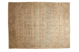 Vintage distressed Kerman carpet with an allover floral pattern in ivory, dusty blue, and sand.
