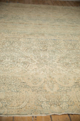 Angled perspective on the distressed pile, showing the Kerman's even wear and allover design.