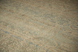 Low, even pile on a distressed Kerman carpet with dusty blue floral vine details.