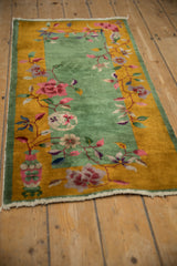 An angled view showing the full length of the vintage Nichols Art Deco runner on a wood floor.