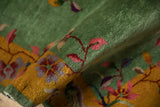 A detailed view of the plush, jade green wool pile on a vintage Art Deco rug runner.