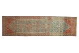 Vintage distressed Persian Malayer runner rug with an allover Herati lattice pattern in sky blue and ruby red.