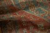 A soft fold highlights the gentle wear and tactile weave of a vintage Persian Malayer rug.