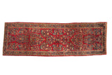 Vintage Persian Sarouk runner, cherry red field with 'crown shyness' floral sprays in blues and green.