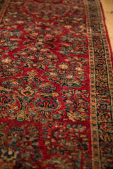 Vintage Sarouk runner detail: cherry red field with 'crown shyness' floral sprays.