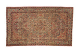 Antique Persian Kerman rug, fluid vinery, starburst medallion, ivory field, cochineal red, sapphire blue.