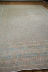 Distressed vintage Mir Sarouk carpet showing sand and sky blue serbend boteh border.