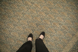 Vintage distressed Persian Meshed rug detail with allover dusty blue and ivory boteh pattern.