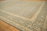 Distressed vintage Meshed carpet corner, featuring dusty denim blue boteh motifs and antique ivory borders.