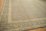 Distressed vintage Meshed rug corner with dusty denim blue border and antique ivory boteh motifs.
