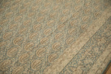 Distressed Meshed carpet detail: dusty denim blue field, antique ivory boteh, subtle border.
