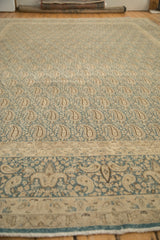 Distressed vintage Persian Meshed carpet's allover boteh field and antique ivory border.