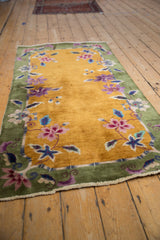 Art Deco floral border with purple, blue, and green lotus-like blossoms.