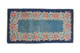 Vintage Chinese Art Deco runner with cobalt blue floral border and open sky blue field.