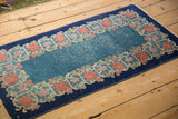 Art Deco Chinese runner with textured sky blue field and stylized floral border.