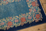Vintage Art Deco rug: cobalt blue field showing foundation, with blush and apricot border.