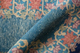 Textured hand-knotted pile of a vintage Art Deco Chinese rug with blue and blush lotus motifs.