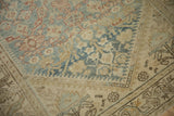 Close-up of vintage Hamadan runner border, showing distressed pale blue and beige henna plant design.