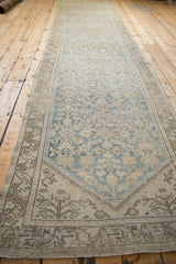 Distressed Hamadan runner close-up showing faded pale blue henna motif and border with even wear.