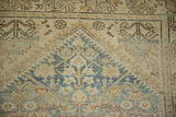 Vintage distressed Hamadan runner detail showing pale blue and beige henna plant motifs with even wear.