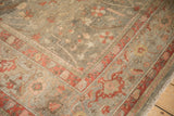 Antique Mahal carpet corner with blush, olive, terra cotta floral lattice design.