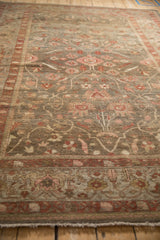 Antique Mahal carpet close-up: delicate floral vines in olive, blush, and copper tones, subtle wear.
