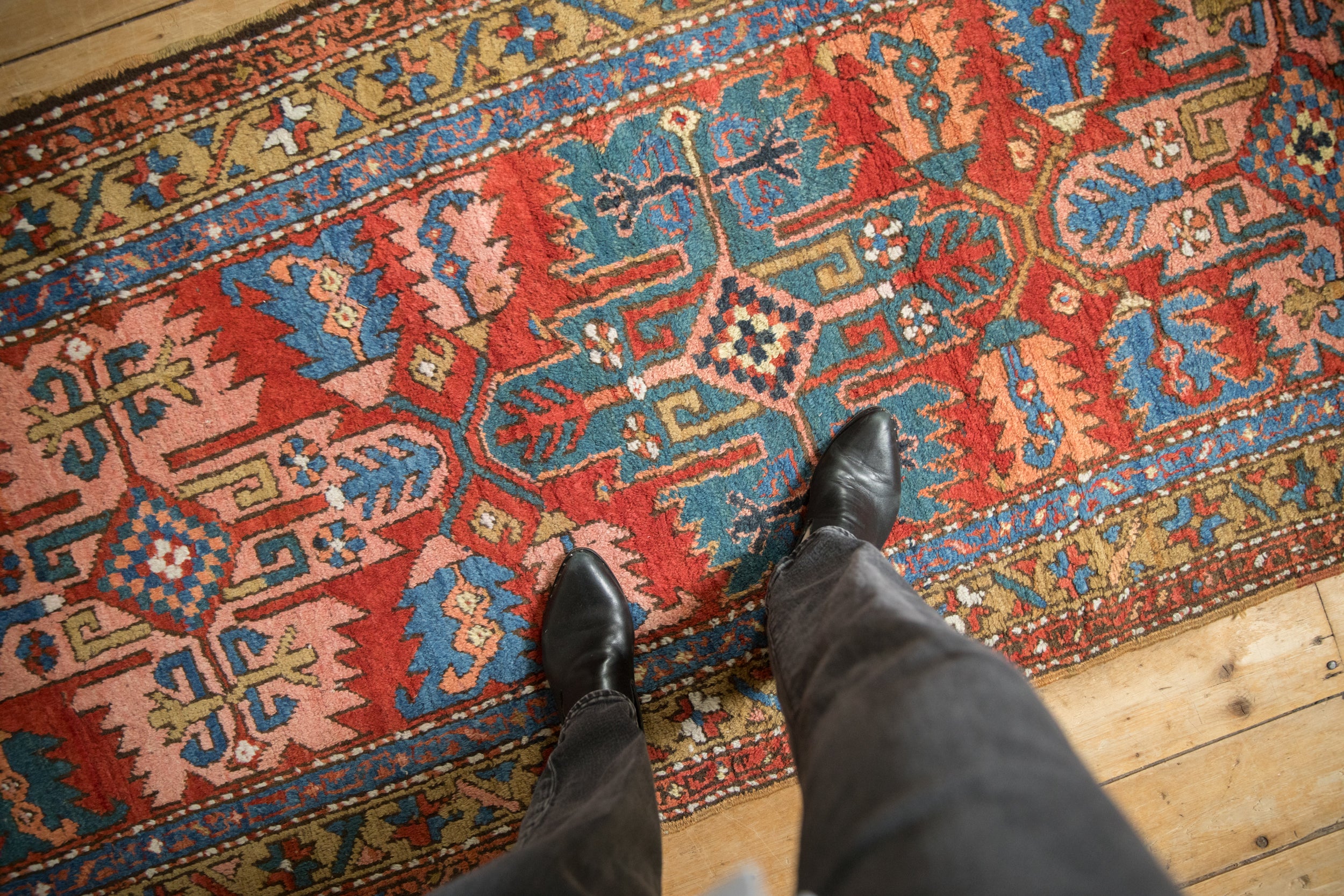 Antique Northwest Persian rug runner with brick red, sapphire blue, blush serrated patterns underfoot.