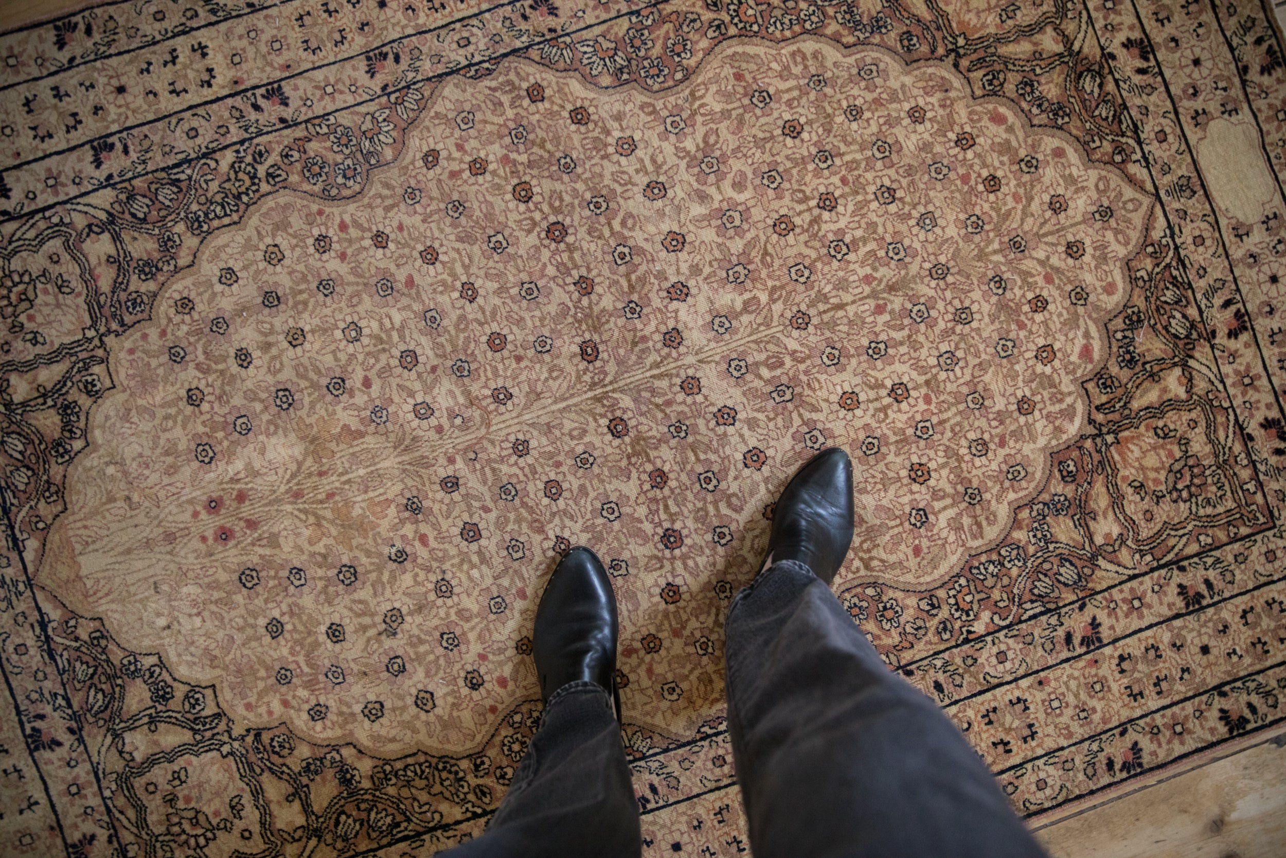 Distressed Kerman rug with thousand flower field and patterned leopard print border.