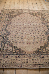 Antique Kerman rug's thousand flower tree-of-life field and patterned tonal border.