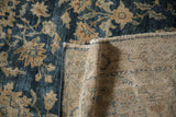 Distressed Persian Yezd carpet pile with cobalt blue floral designs and hand-knotted foundation.