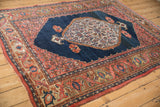 Antique Bijar rug border featuring turtle samovar, deer heads, and serrated spandrel in blue, blush, brown.
