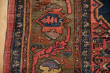 Antique Bijar rug detail: deer head rendering adjacent to intricate border.