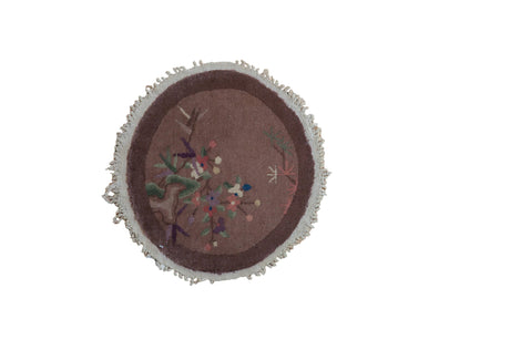 Antique Chinese Art Deco round rug mat, dusty mauve field, colorful floral blossoms, ivory fringe. 1'6" x 1'7".