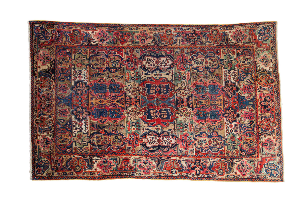 Antique Mohajeran Sarouk carpet, allover reciprocal cartouches in cherry red, navy, beige. 5'10" x 9'3".
