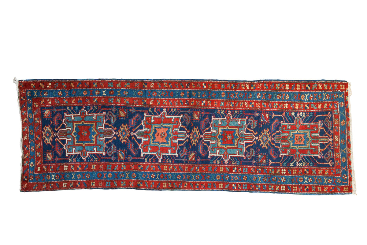 Antique Northwest Persian Heriz-Karaja runner, geometric medallions, deep sapphire blue field, ruby red borders.