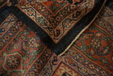 Hand-knotted texture and classic turtle samovar border on a vintage Mahal carpet corner.