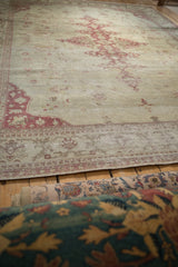 Low-angle view showing the distressed texture and decorative borders of an Indian Amritsar carpet.