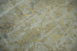 Vintage Kayseri rug pile with muted ivory, dusty gold, and sea foam green vinery.