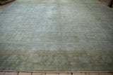 Faded pile of the vintage Kayseri carpet, showing soft sea foam green and dusty gold vinery.