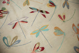 Close-up of the hand woven Pakistani Kilim's varied color dragonfly motifs and plain weave.