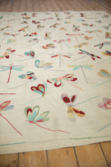 Plain woven Pakistani Pictorial Kilim with varied dragonfly motifs on an ivory-beige ground.