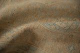 Decorative wear on a distressed vintage carpet, showing the low hand-knotted pile and texture.