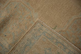 Hand-knotted back and secured side cord of a vintage Persian Birjand carpet.