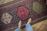 Intricate borders, plum, navy, jade green henna plant motifs on antique Karabagh runner.